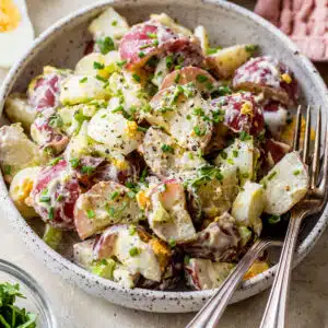 healthy potato salad in a bowl with a fork
