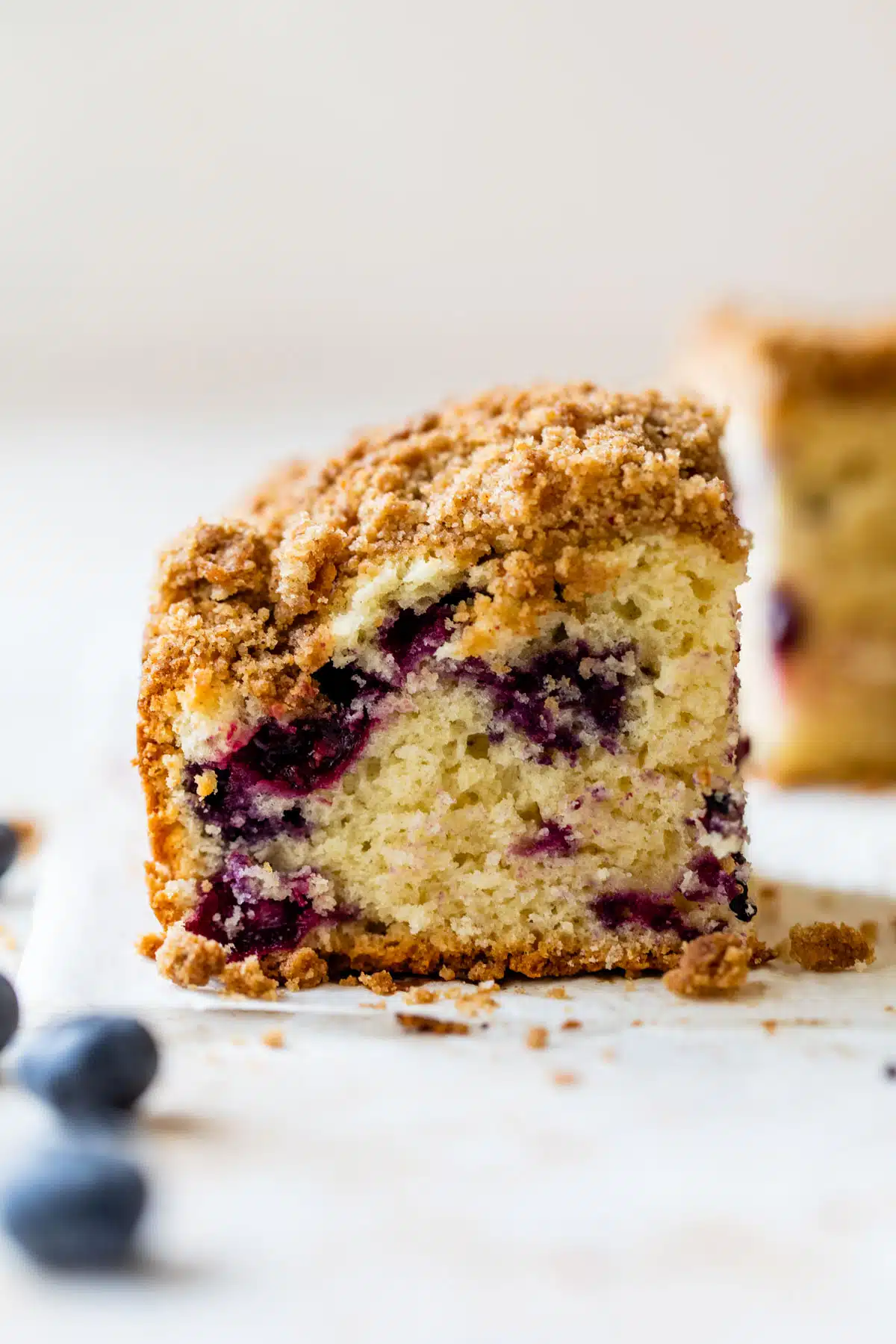 a piece of coffee cake with blueberries