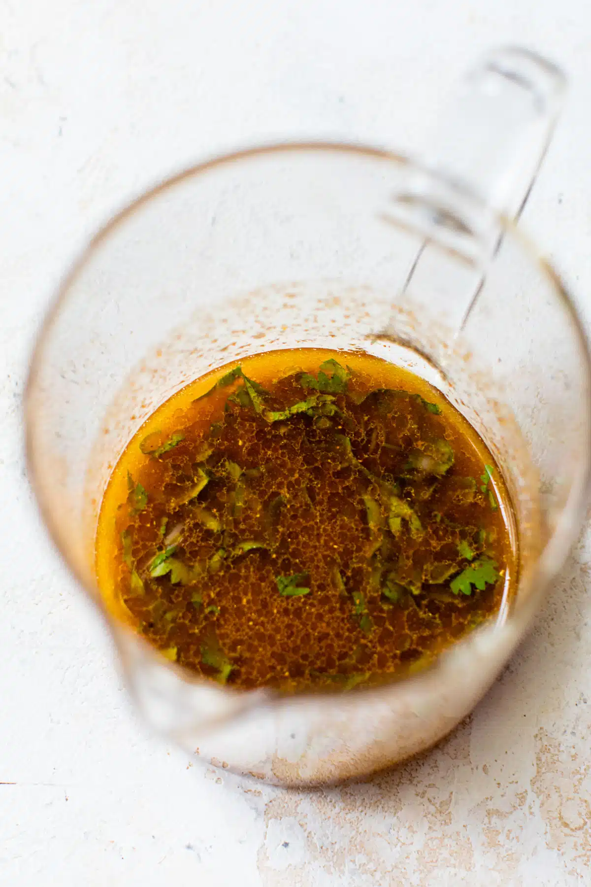 homemade vinaigrette in a glass measuring cup