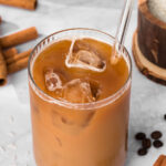 overhead view of an iced horchata latte in a glass.