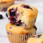 side view of a stack of 2 lemon blueberry muffins.