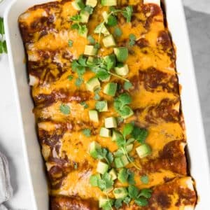 overhead view of tofu enchiladas in a baking dish.