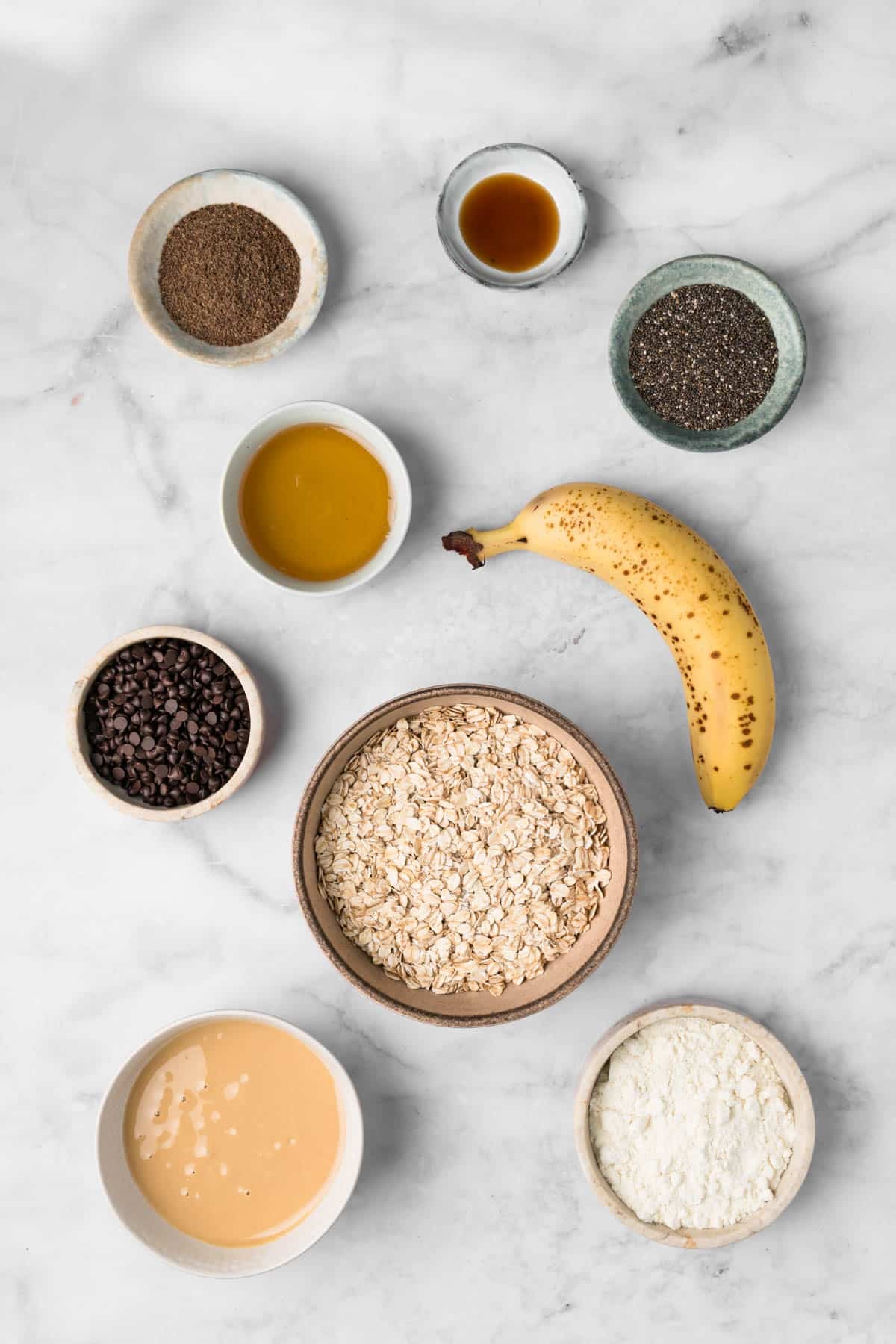 Overhead view of the ingredients for breakfast cookies, and individual bowls.