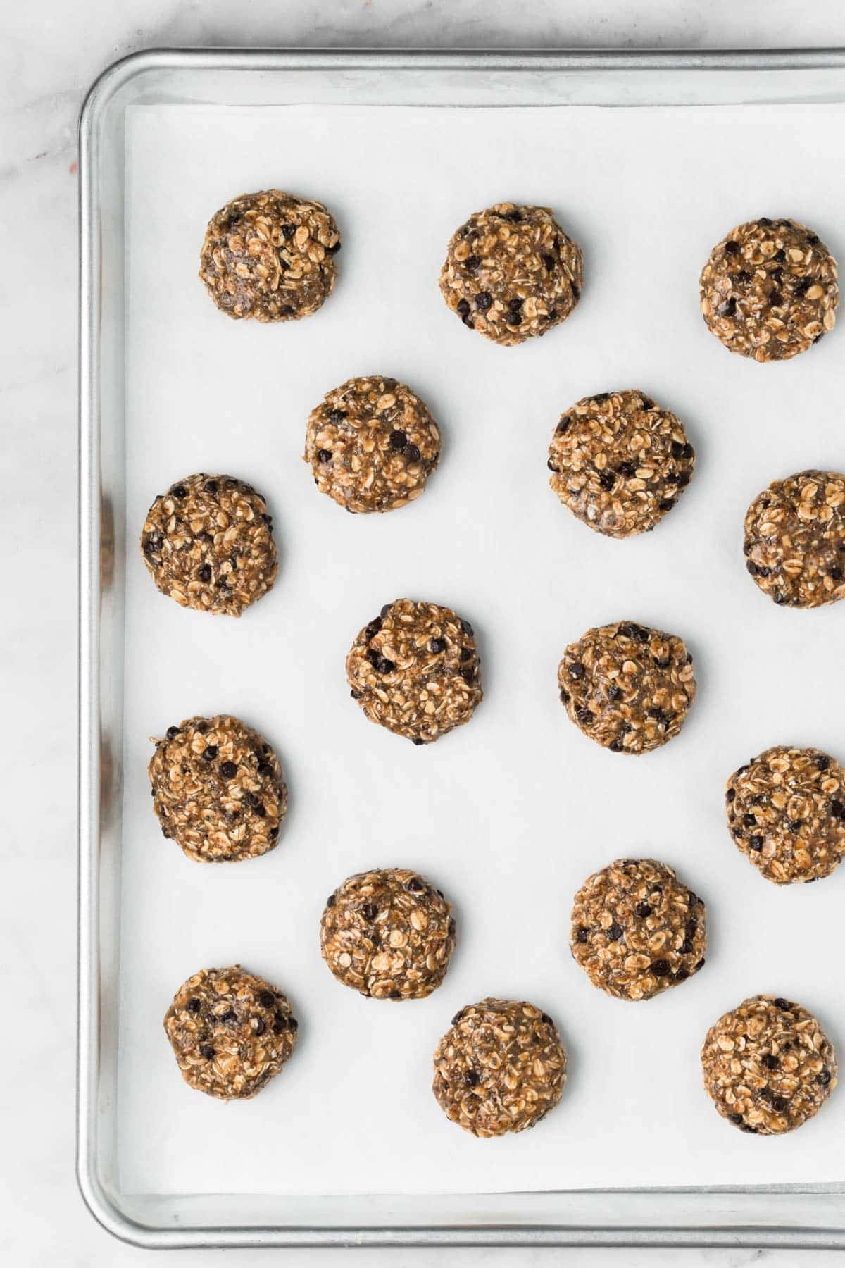 Overhead view of baked breakfast cookies on a baking sheet.