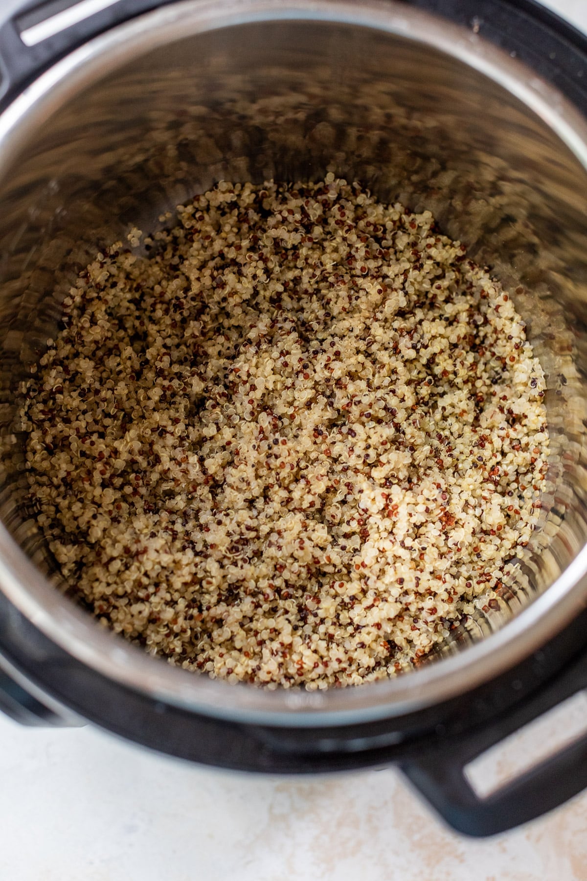 overhead view of cooked quinoa in an Instant Pot.