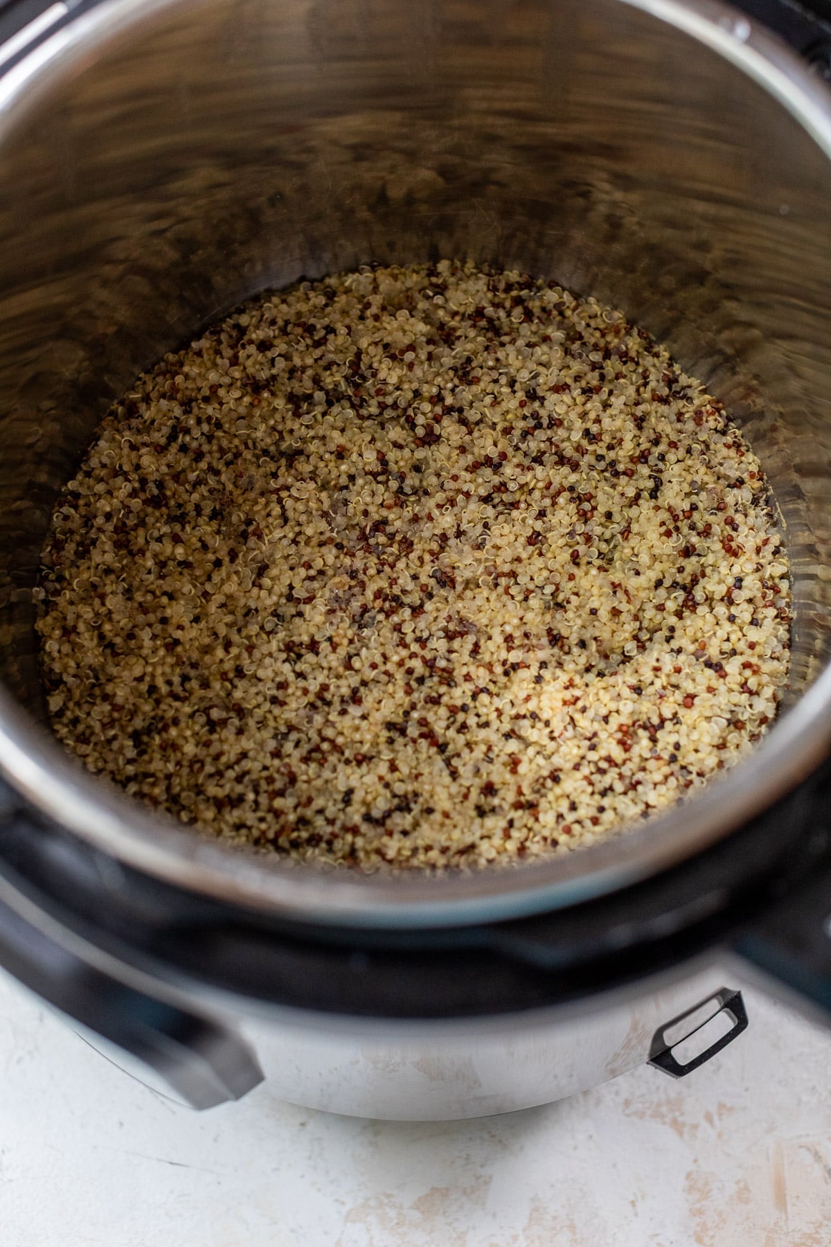 overhead view of cooked quinoa in an Instant Pot.