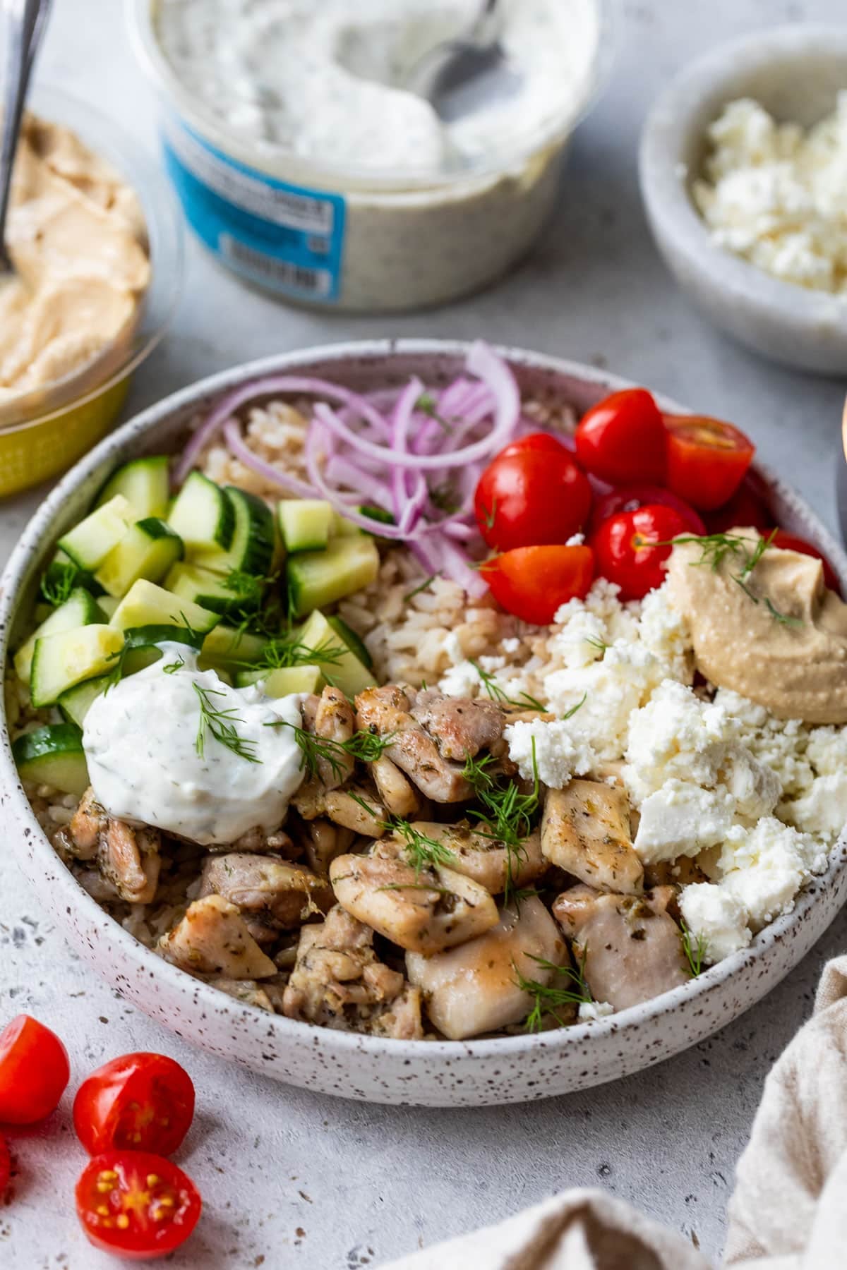 side view of an assembled Mediterranean Chicken Bowl.