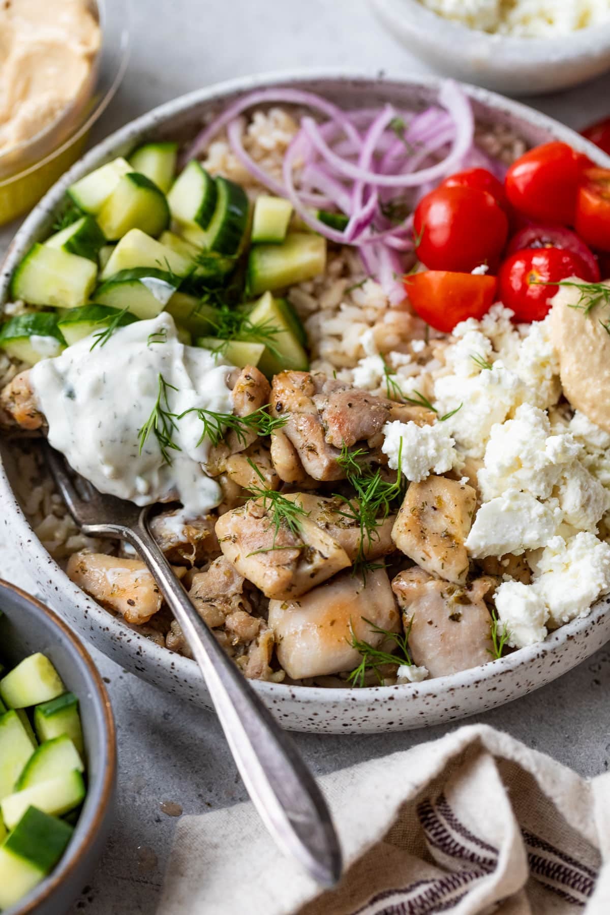 side view of an assembled Mediterranean Chicken Bowl.