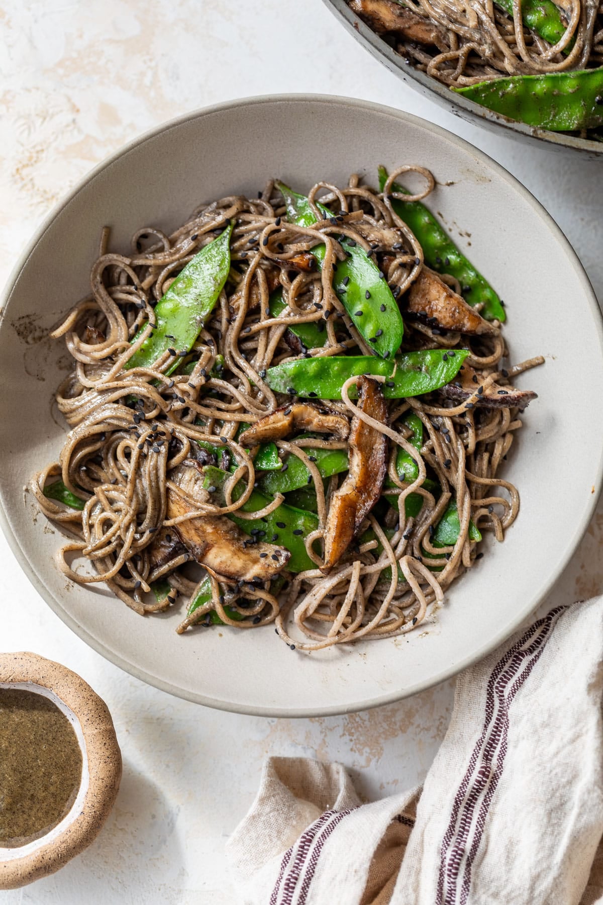 overhead view of a bowl of Black Sesame Tahini Noodles.