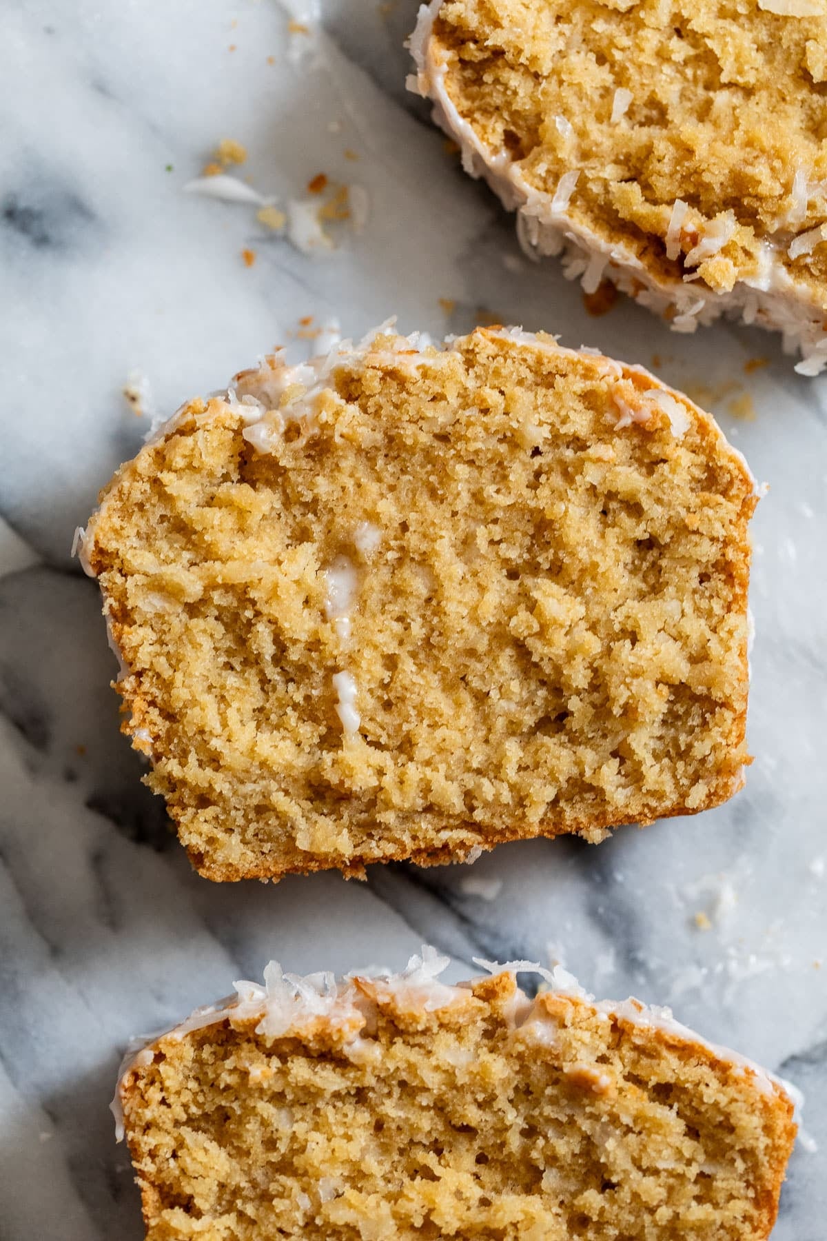 overhead view of 3 slices of sweet coconut bread.