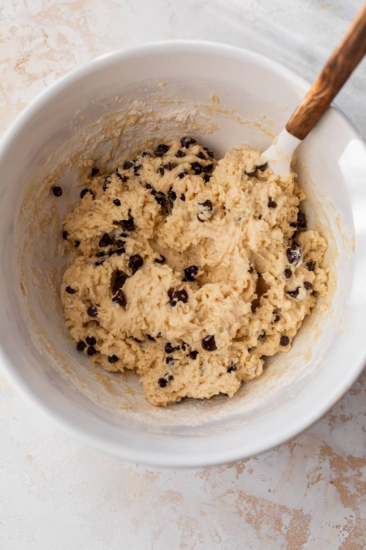 overhead view of the batter for greek yogurt muffins in a white bowl.