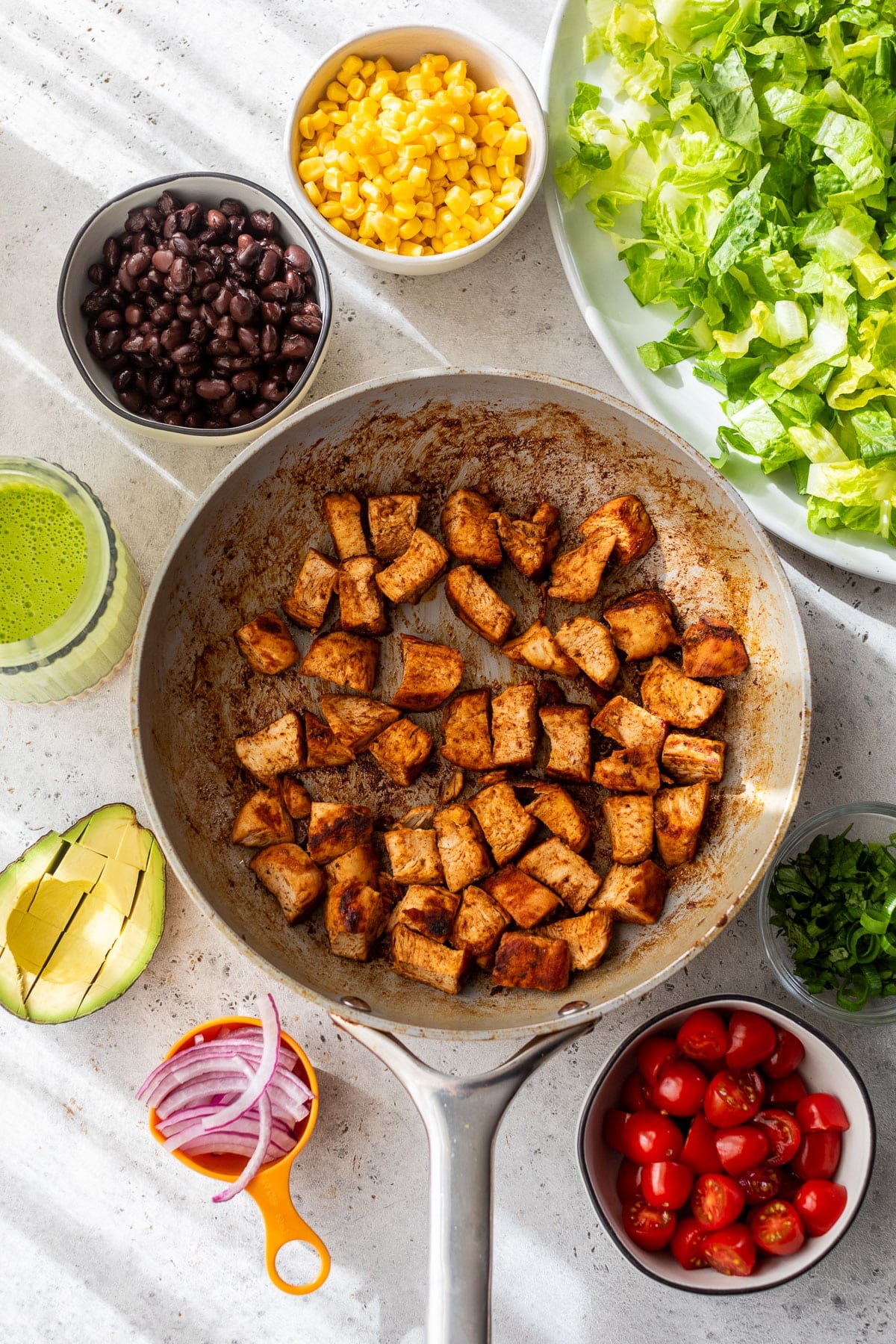 overhead view of the ingredients for a chicken taco salad.