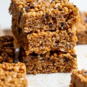 Side view of a stack of 3 Healthy Peanut Butter Rice Crispy Treats.