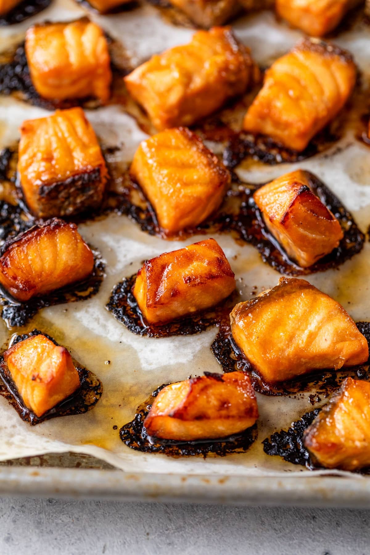 close up on baked marinated salmon bites for honey chipotle salmon bowls.